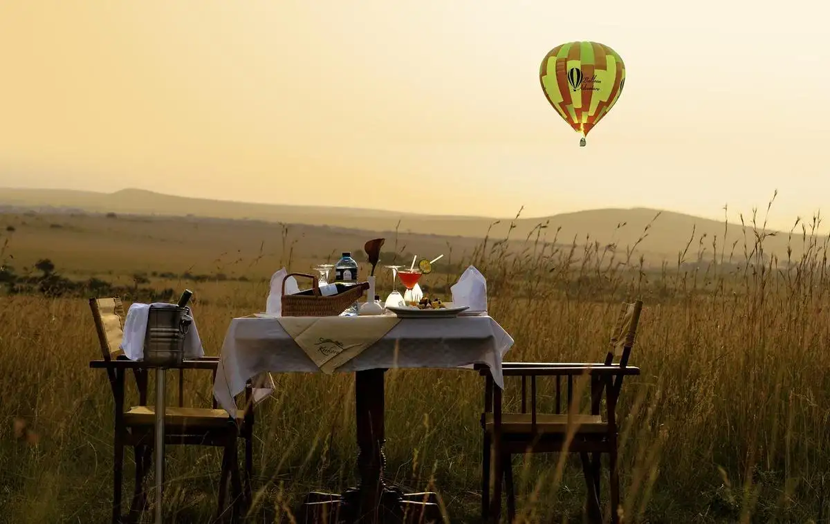 When to go maasai mara? Experience the romance of a maasai mara honeymoon safari from a hot air balloon, soaring above the breathtaking landscape at sunrise.